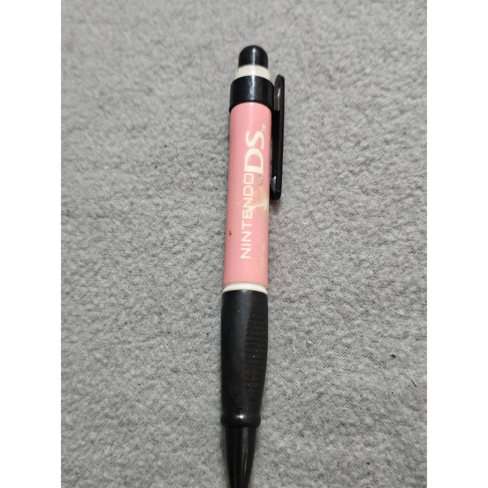 pink retractable pen stylus for the Nintendo DS with a black rubber grip.